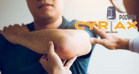 Mann med tennisalbue.